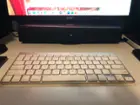 Tucked under a 24" monitor, click to load a larger version