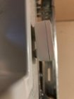 Shim on the bottom to make it tilt up, to compensate for the inaccurate leveling mechanism inside, click to load a larger version