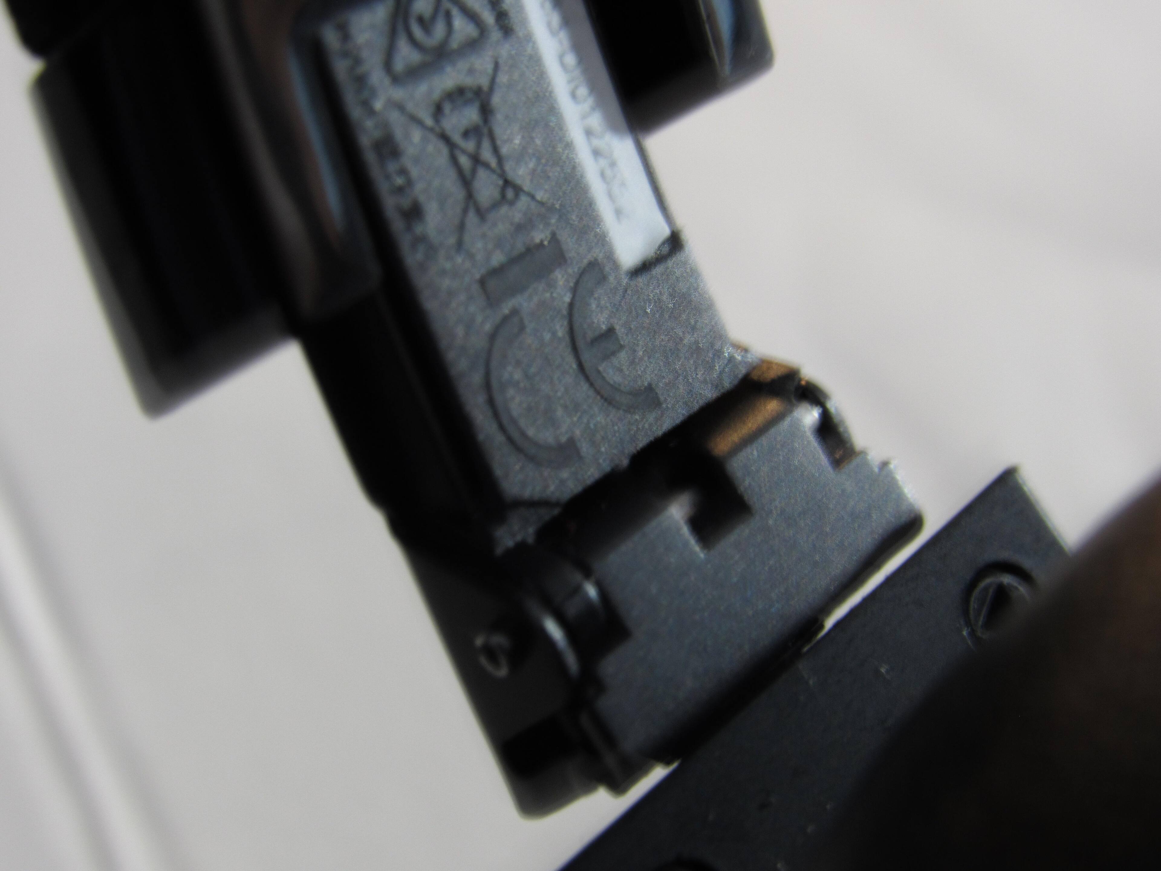 A Picture of the left hinge in the metal frame with cracks, click to load a larger version