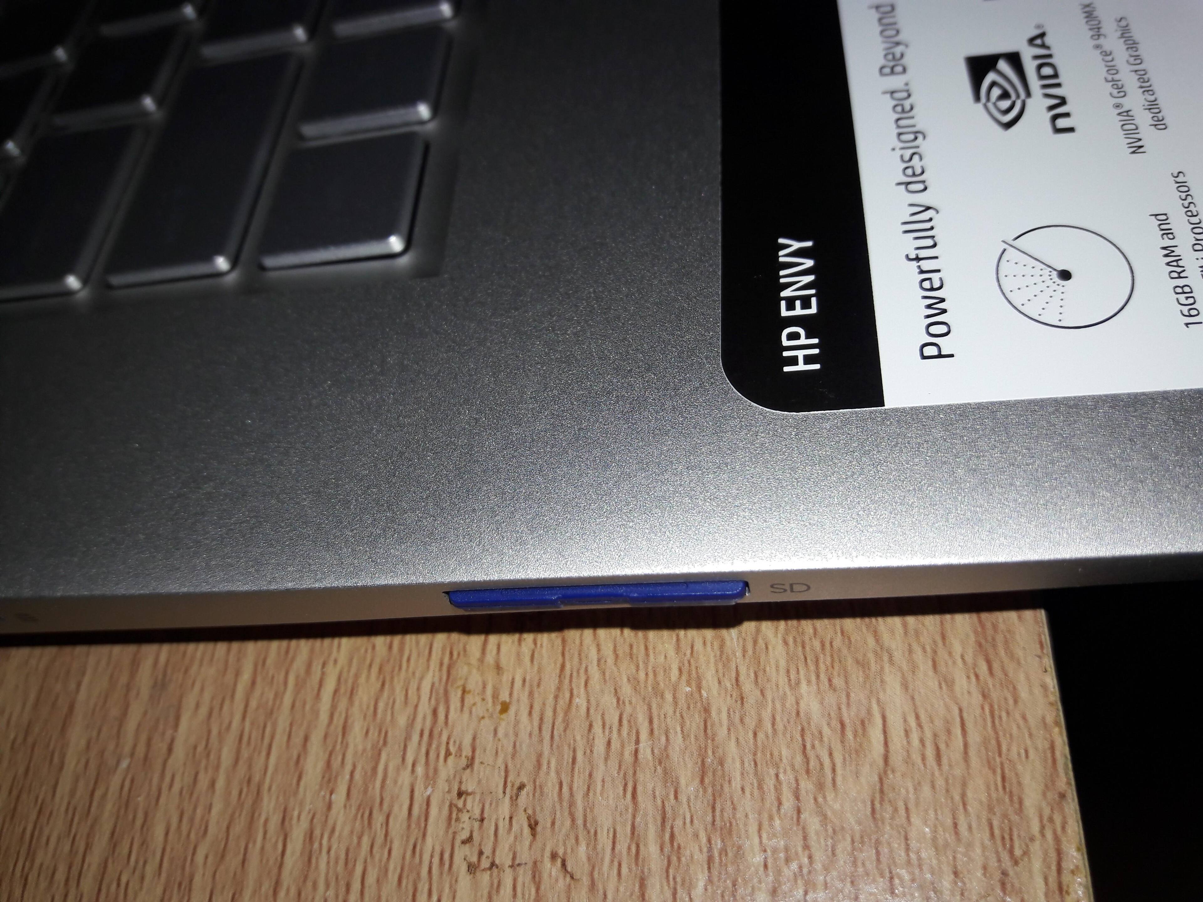 It basically swallows the entire SD card. You need tweezers to pull it out., click to load a larger version