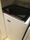 It fits in the closet (see the door?) and is the same length as my Maytag Bravos dryer., click to load a larger version