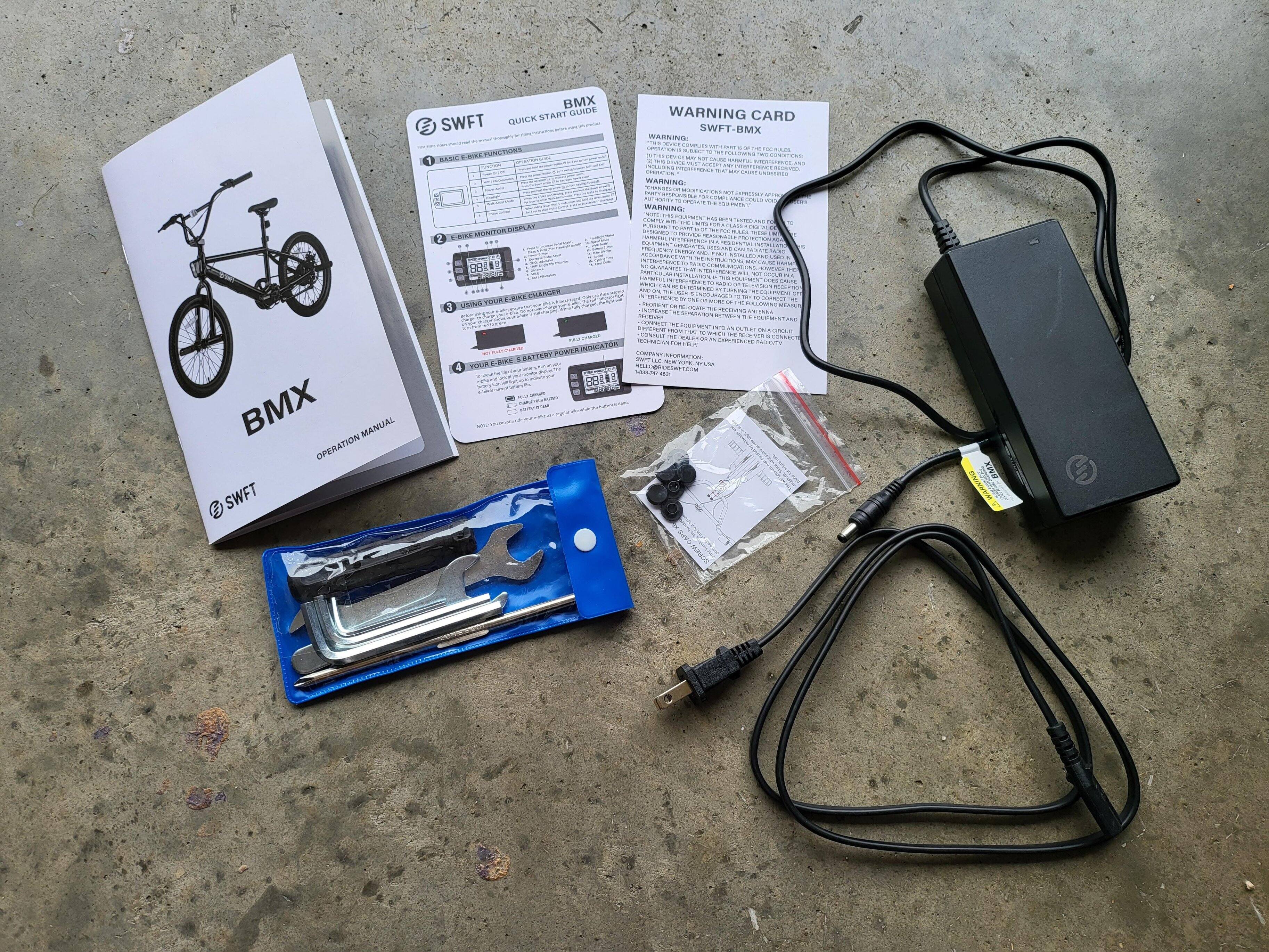 Other items in the box, charger, tools, click to load a larger version