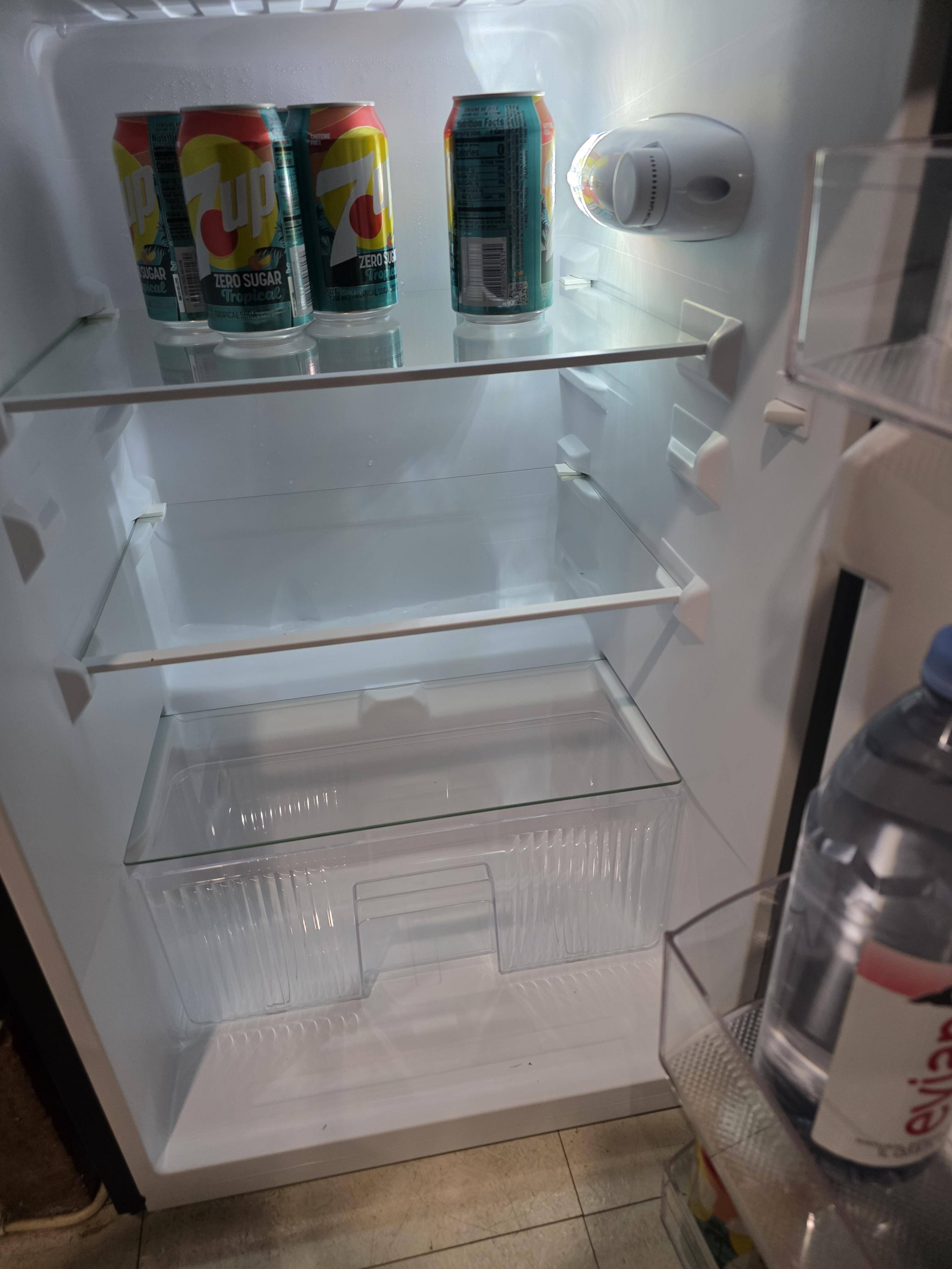 Fridge compartment with removable glass shelves, click to load a larger version