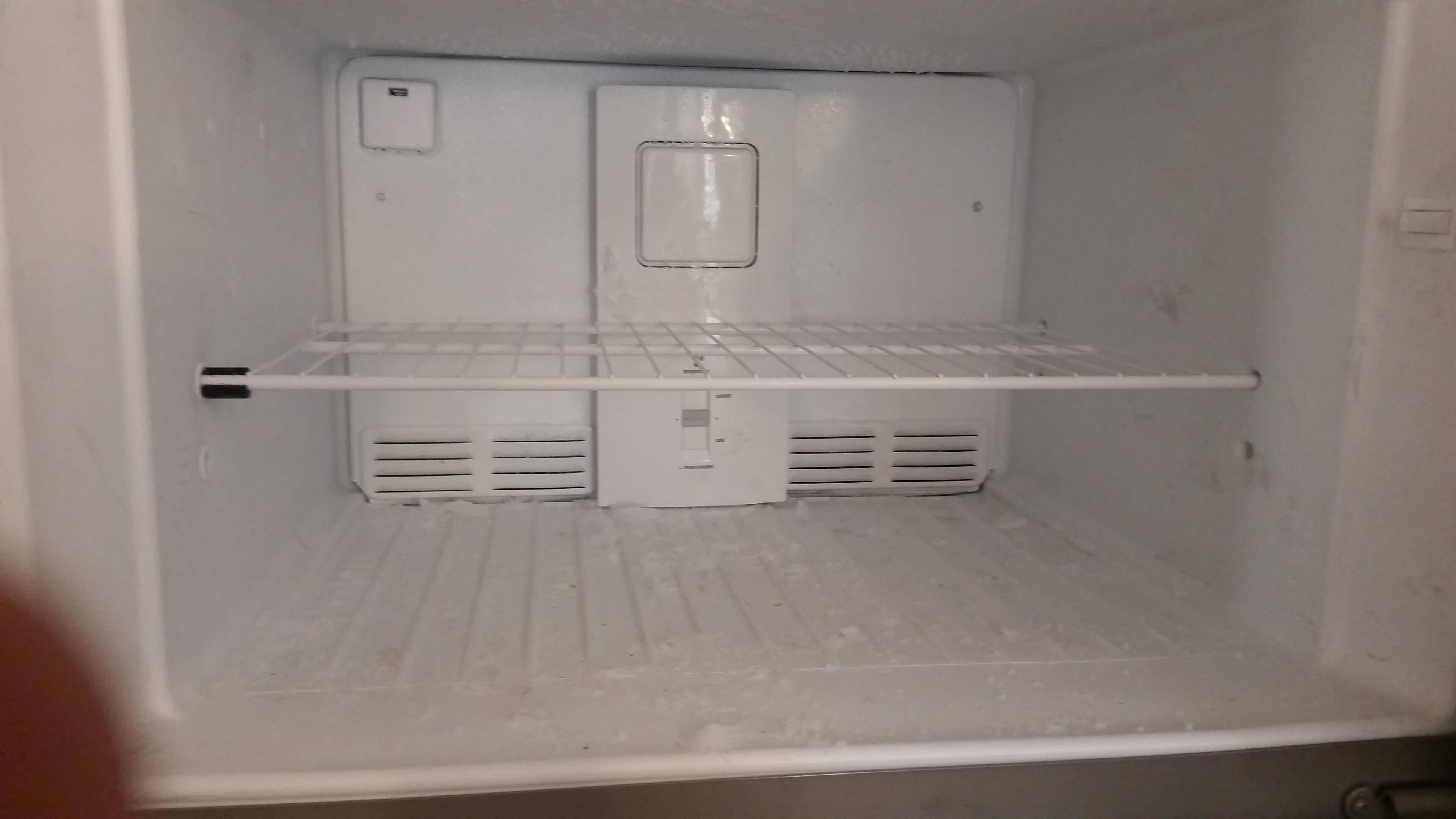 ice left after emptying fridge, click to load a larger version