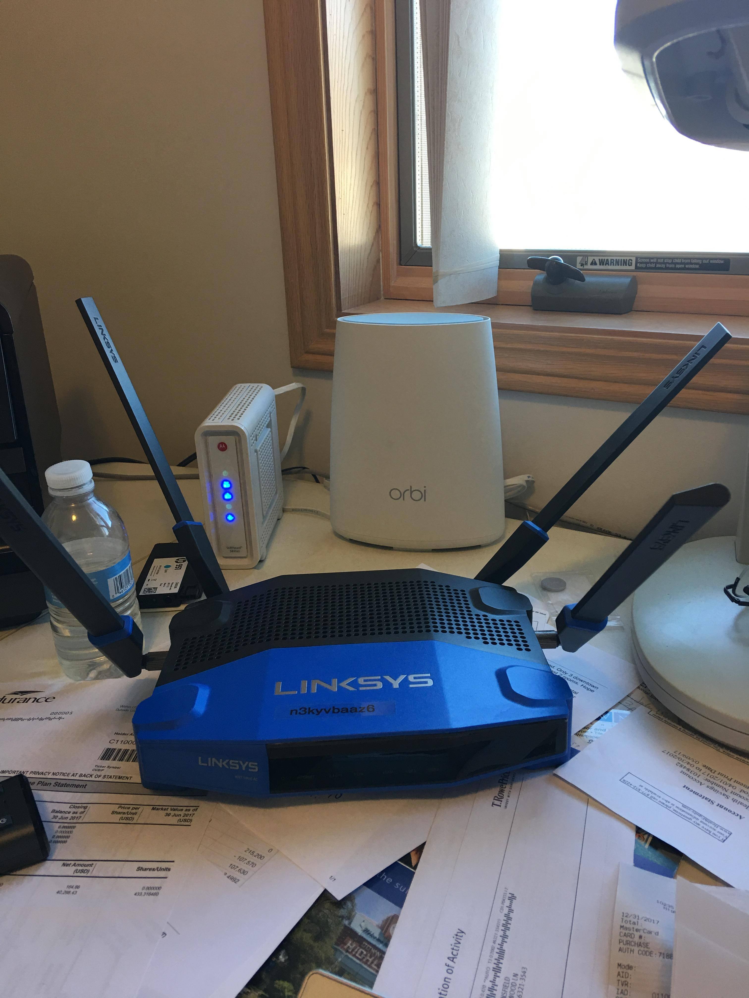 Orbi in the background, old Linksys up front, click to load a larger version