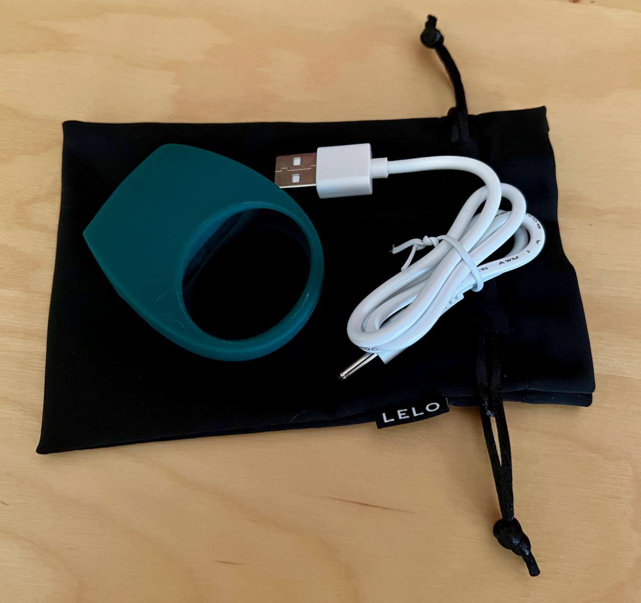 Pouch, toy and cable., click to load a larger version