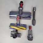 The included attachments: (from top to bottom, left to right) Digital Motorbar XL cleaner head, Fluffy Optic cleaner head, Hair screw tool, dusting/crevice tool, and wide nozzle/brush., click to load a larger version