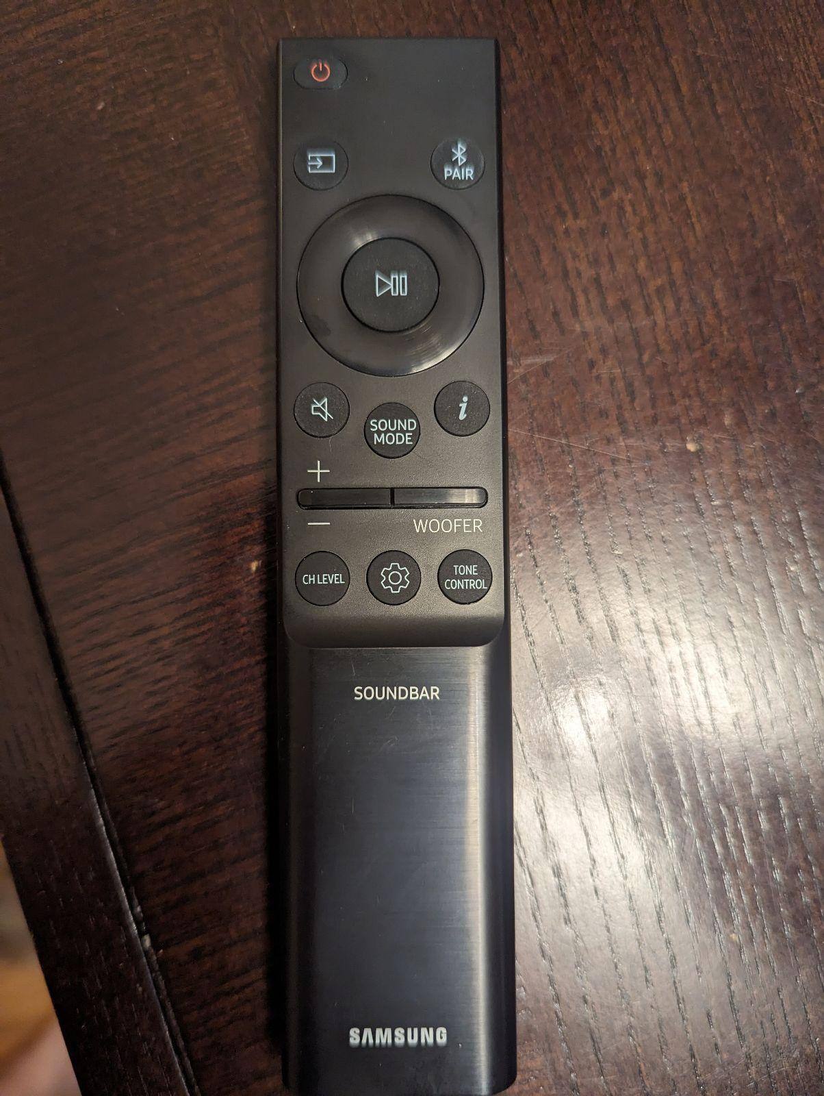 Remote is sleek design, with toggle volume / woofer buttons mid remote, click to load a larger version
