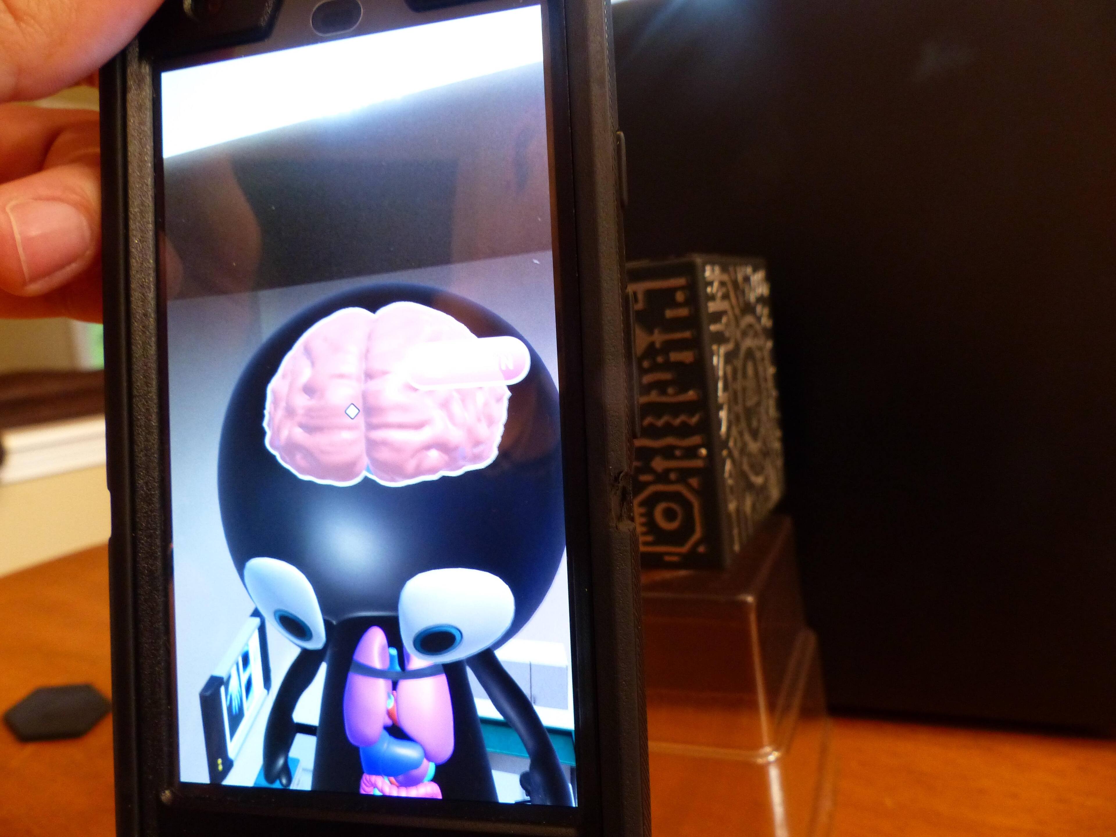 Note: cube is behind phone., click to load a larger version