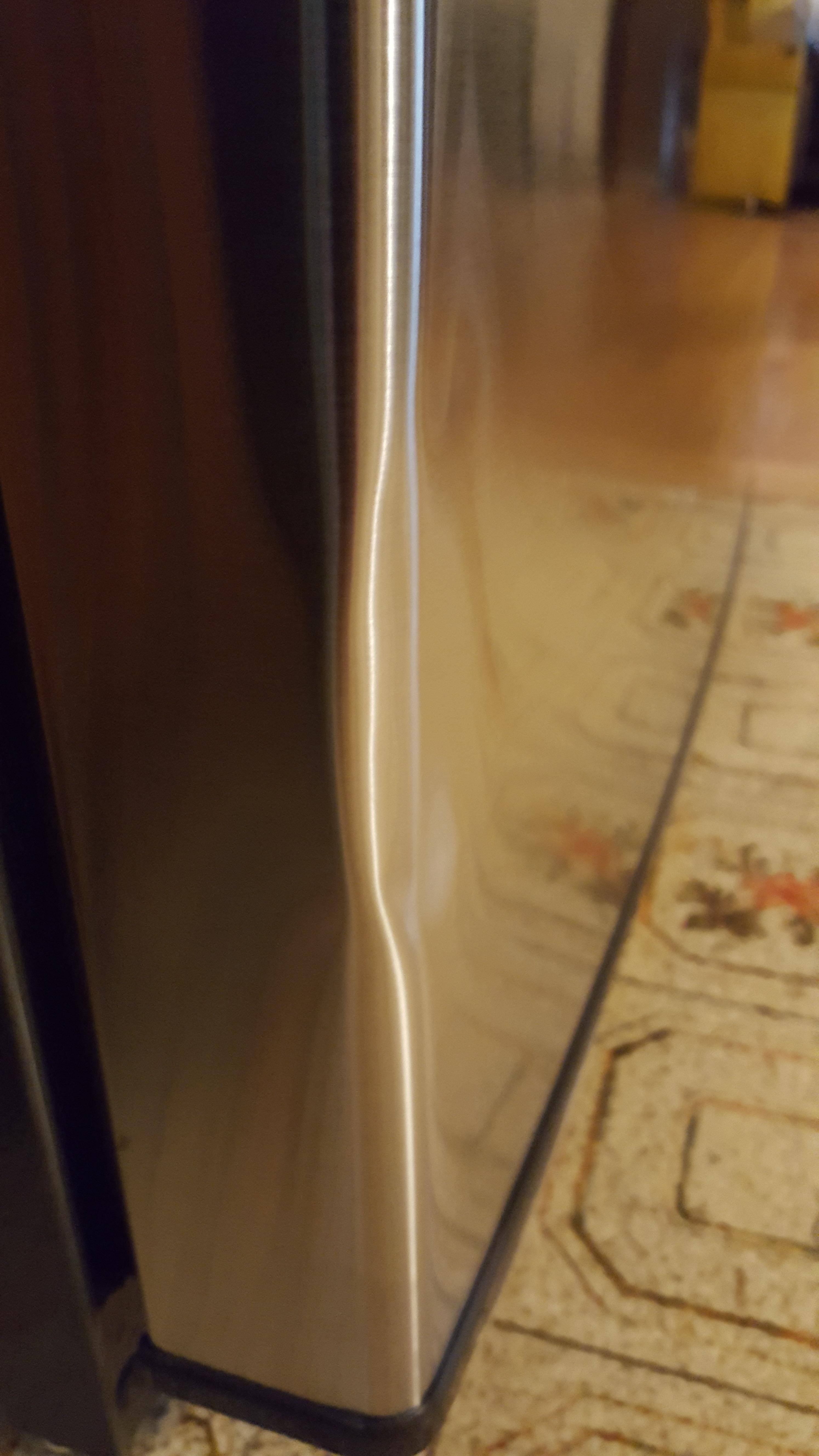 damaged fridge door, click to load a larger version