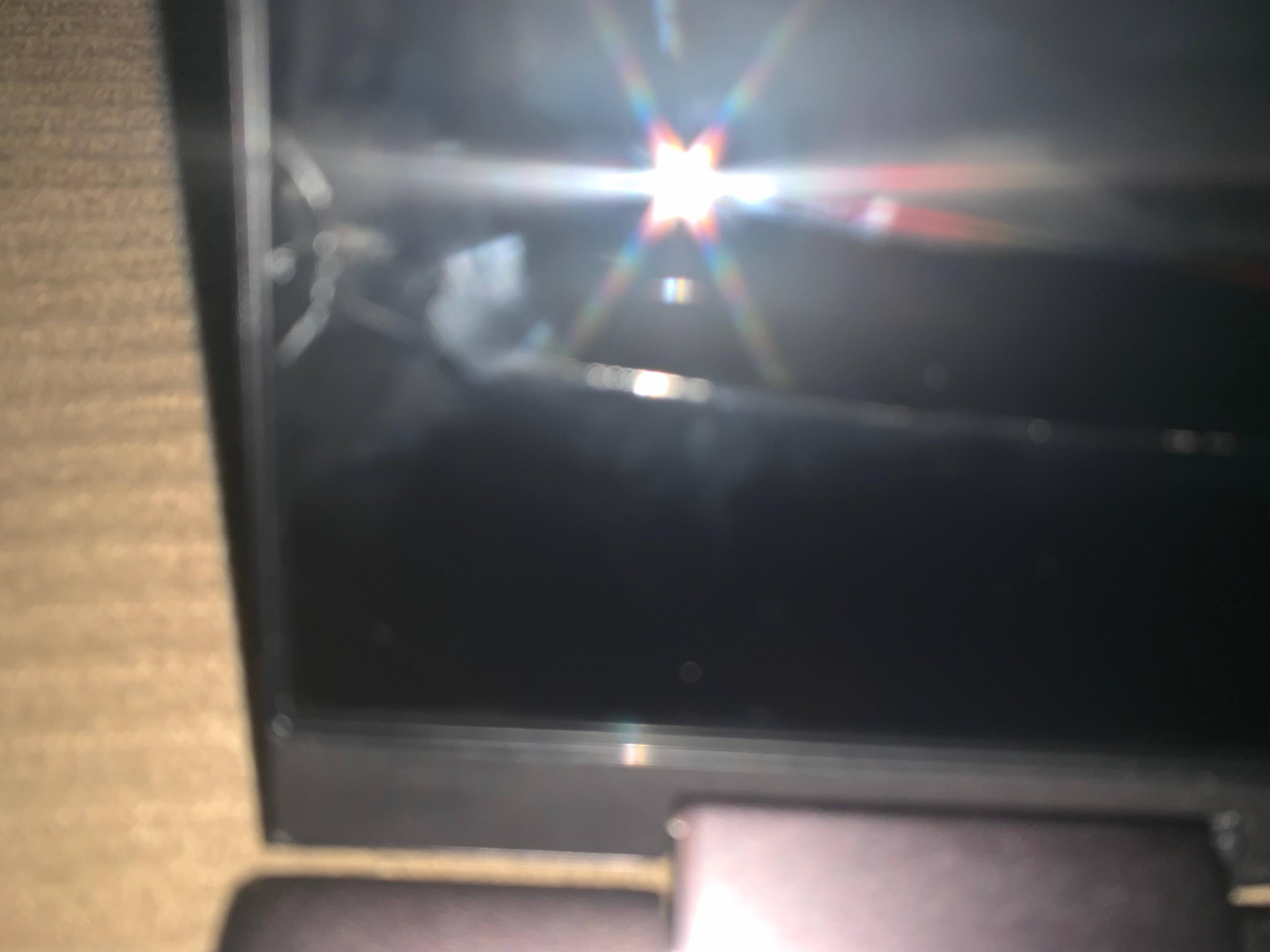 Half circle crack from finger opening the computer then it extends to the right, click to load a larger version