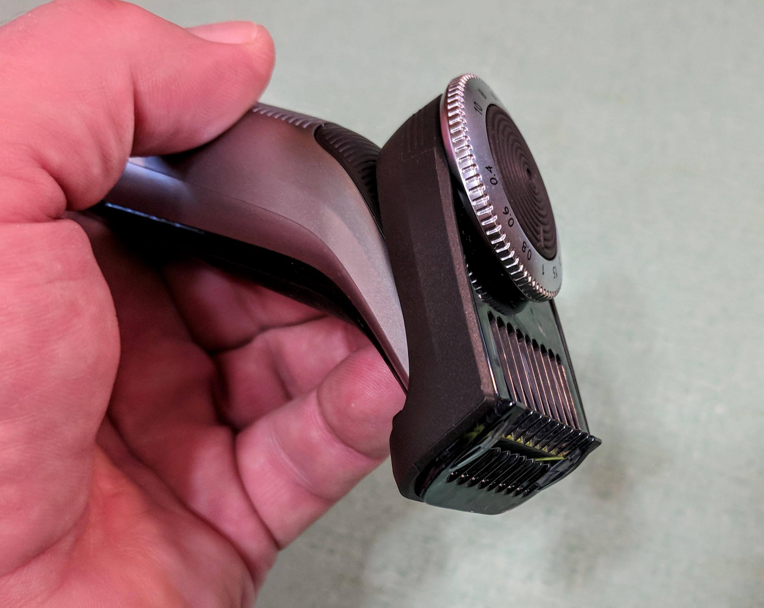 Here's the OneBlade with the trimmer attached - when using the OneBlade to trim, (especially below my chin), the angle of the handle made it difficult and klutzy to hold., click to load a larger version
