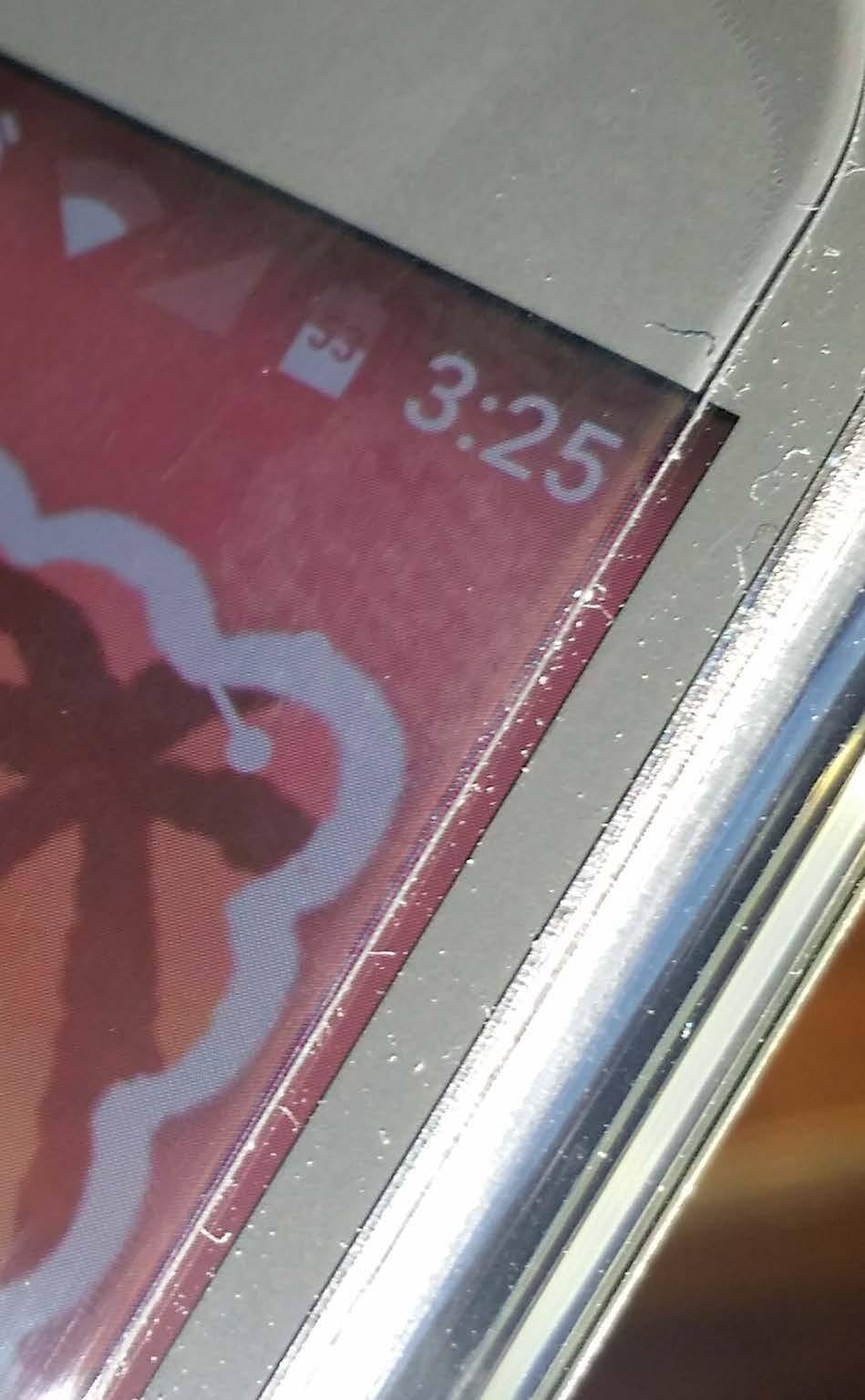 From an angle the issue appears magnified, but its like this on both sides. I layed the protector dead center and lined everything up., click to load a larger version