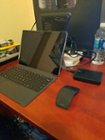 My "Gaming" setup, all games are isntalled on a portable 2TB WD Passport and there is a small fan aimed at the processor in the Surface's top right corner to prevent throttling., click to load a larger version