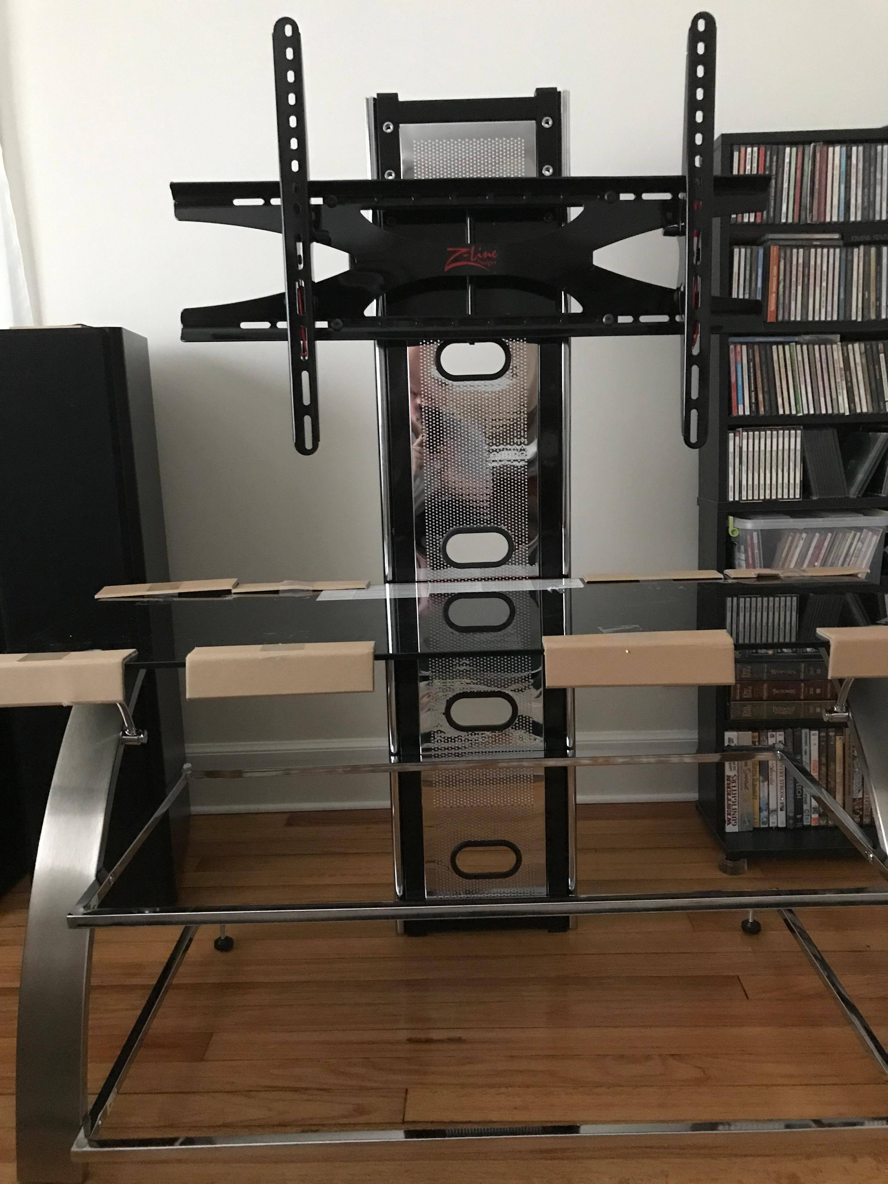 Cardboard corners to protect top glass shelf during setup. Lower 2 shelve not in place yet., click to load a larger version