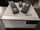 Front of Projector + Remotes + Dongle, click to load a larger version