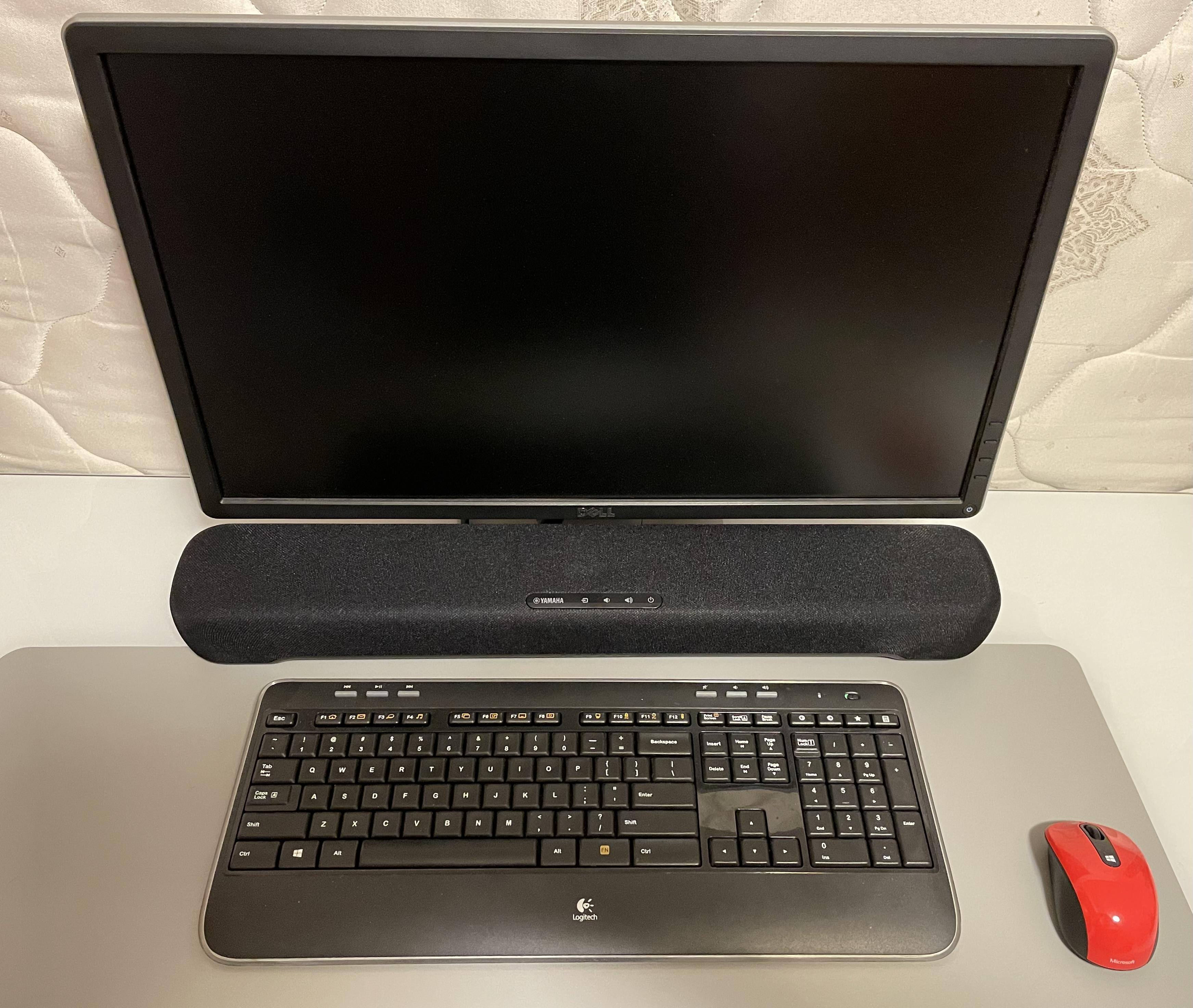 Can be used with a wide variety of monitor sizes like this 24" model at a standup desk., click to load a larger version