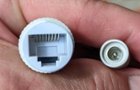 Each camera is powered through the (included) ethernet cable - that cable also returns the image to the base system. The separate cord from each camera (on the right in this photograph) appears to be a power connection and is wholly unused in this system., click to load a larger version