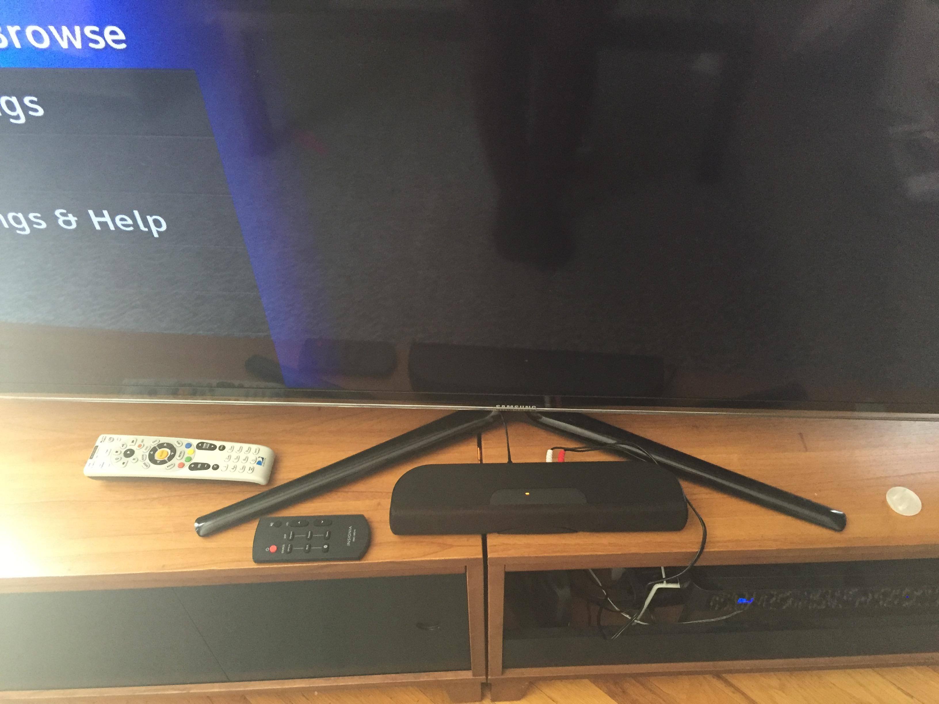 soundbar, remote, and base of TV, click to load a larger version