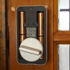 Inside of Wyze lock, battery bay, latches, and pairing button, click to load a larger version