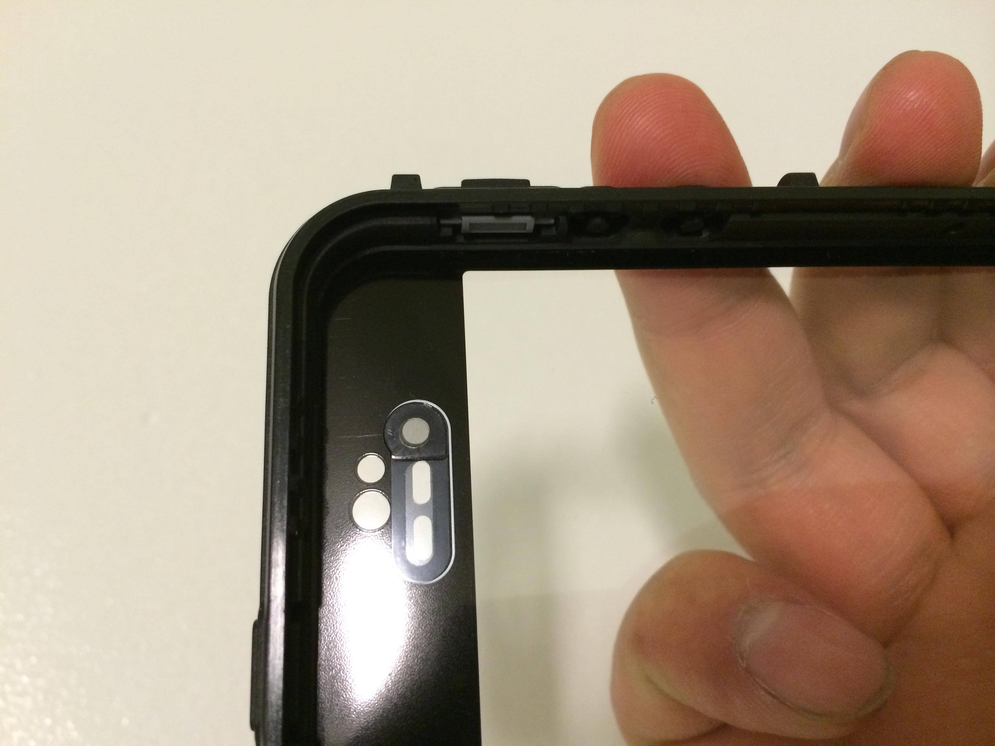 the piece of plastic that caused screen to pop out., click to load a larger version