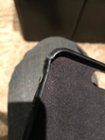 One of the broken corners that just happened from gently taking my phone out of the case., click to load a larger version