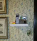 base unit on floating 5 1/2x12" shelf at wall jack, click to load a larger version