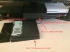 The regular PS4's hardware partition that covers the harddrive compartment has been removed and placed next to the console. This external partition does NOT require tools for perform its removal/replacement., click to load a larger version