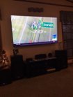 Wall mounted 75" tv above the stand, click to load a larger version