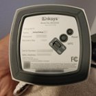 Base of unit, rubber foot, power switch, reset and WPS buttons, setup WiFi info and recovery key obscured, click to load a larger version