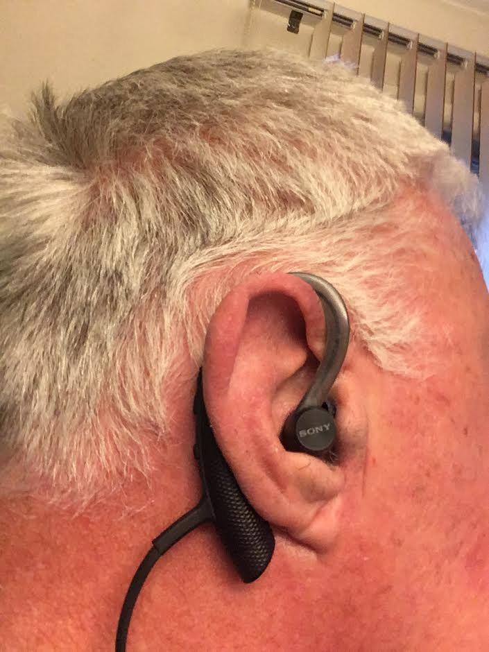 Wearing it comfortably and securely on my right ear., click to load a larger version