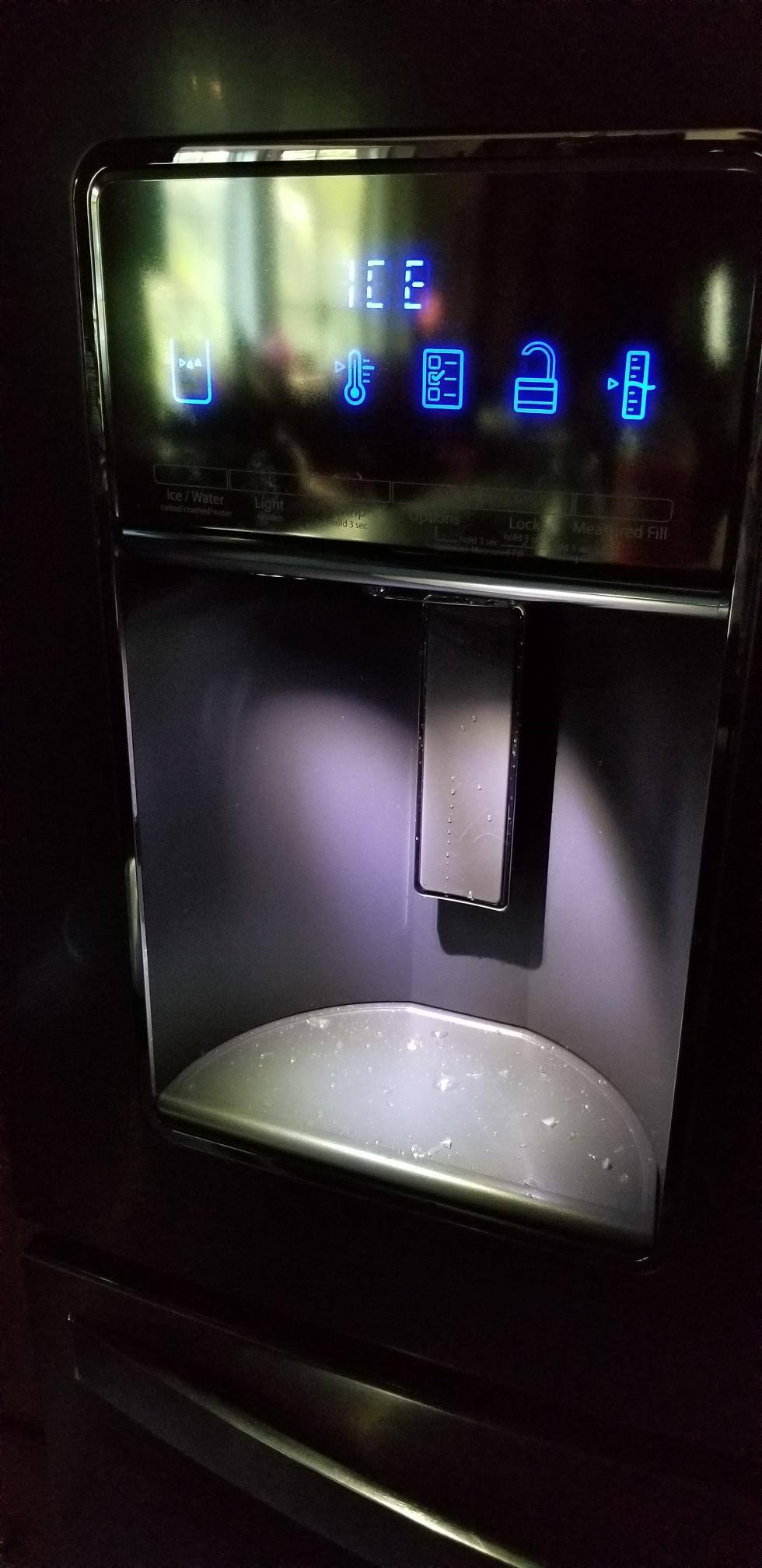 ice maker is messy and water spigot is forward of the icemaker, which causes water to spill if not careful, click to load a larger version