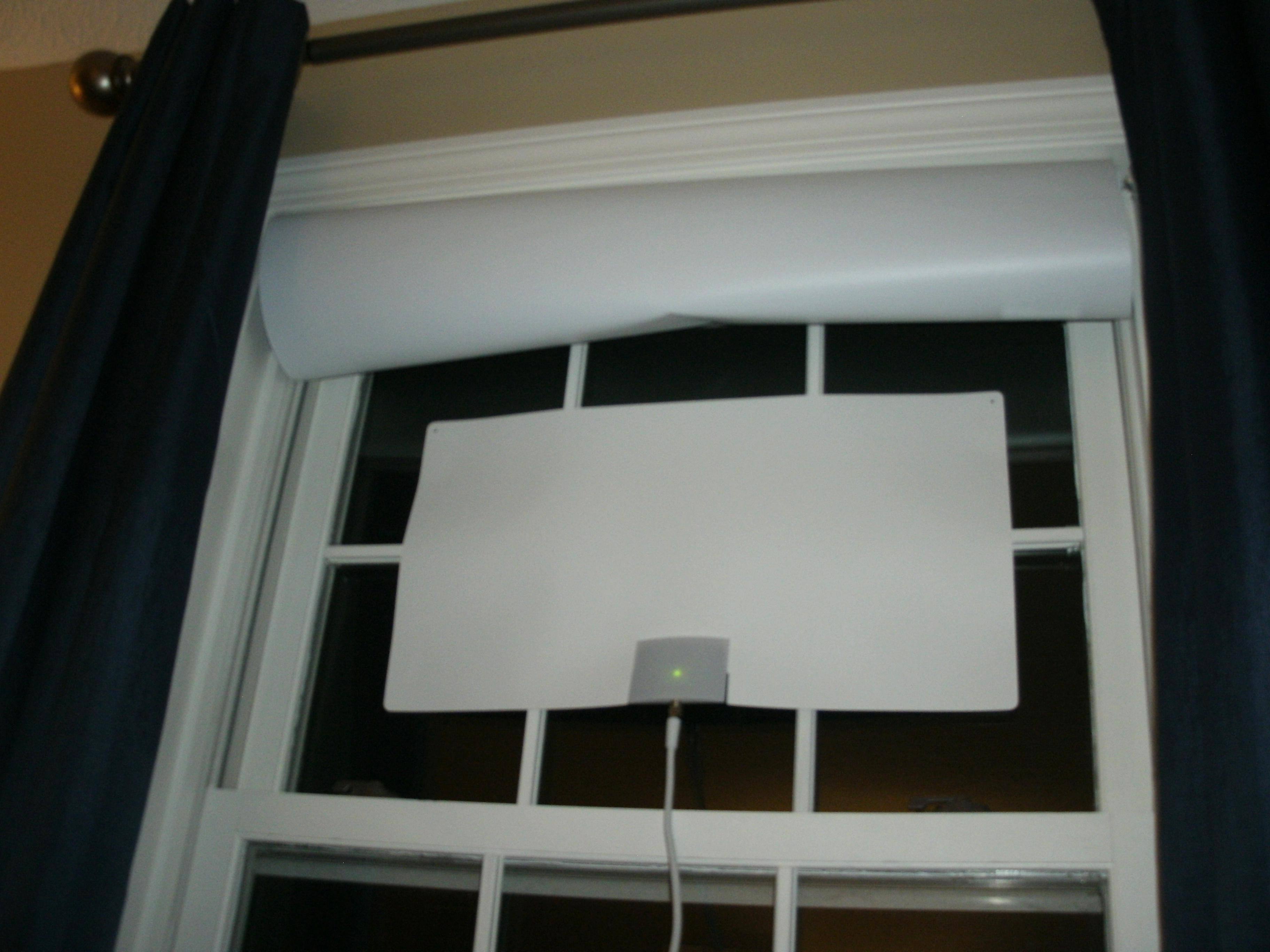 The Mohu Leaf Supreme Pro fits easily in standard-width windows and can hide behind a blind or curtain., click to load a larger version