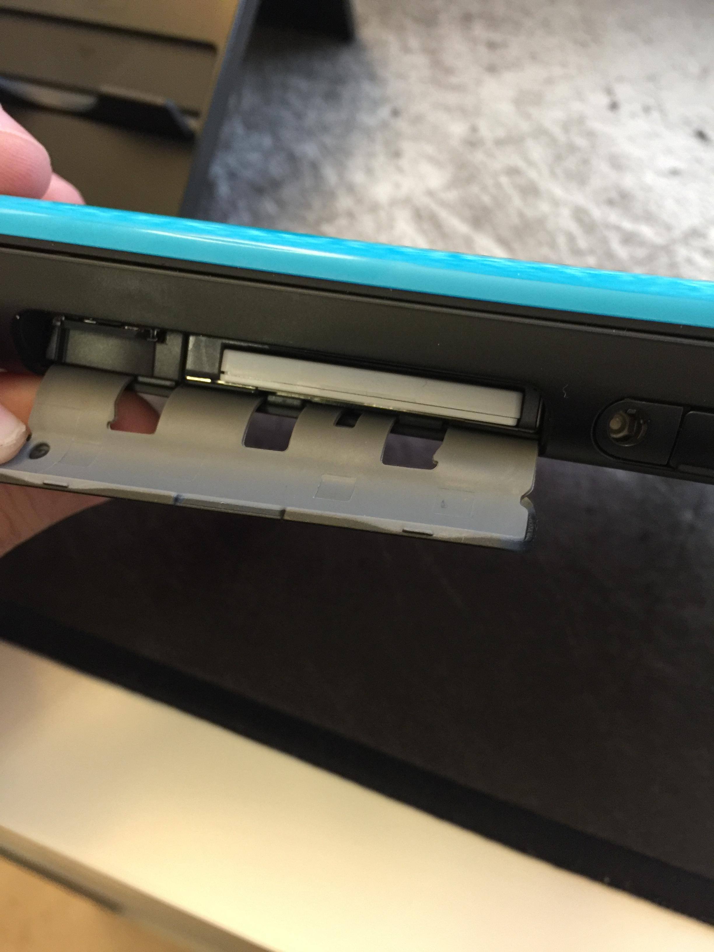 Flap that covers the micro sd and game slots, click to load a larger version