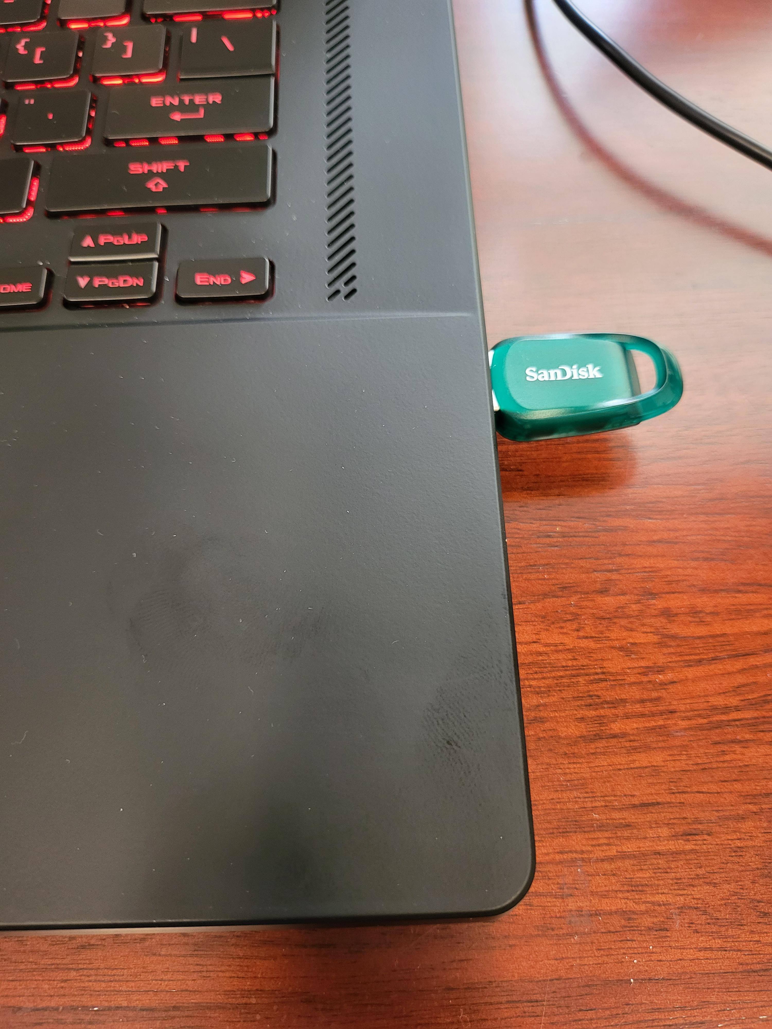 Thumb drive in computer, it looks wide, as if it might block other USB devices in a port next to it, but I found it to be as thick as my other standard looking thumb drives, click to load a larger version