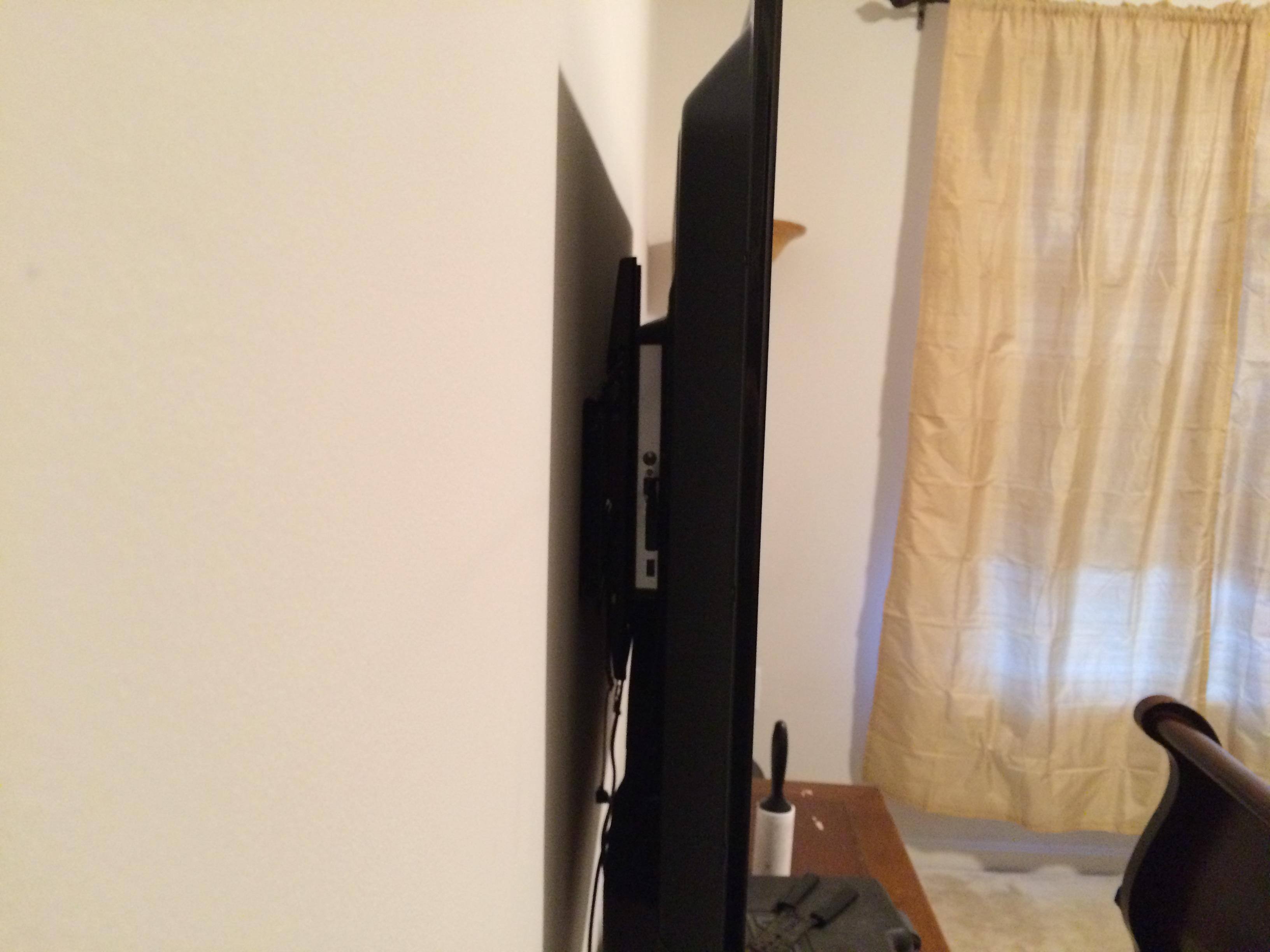 The gap - note it looks larger because the back part of the TV sticks out, click to load a larger version