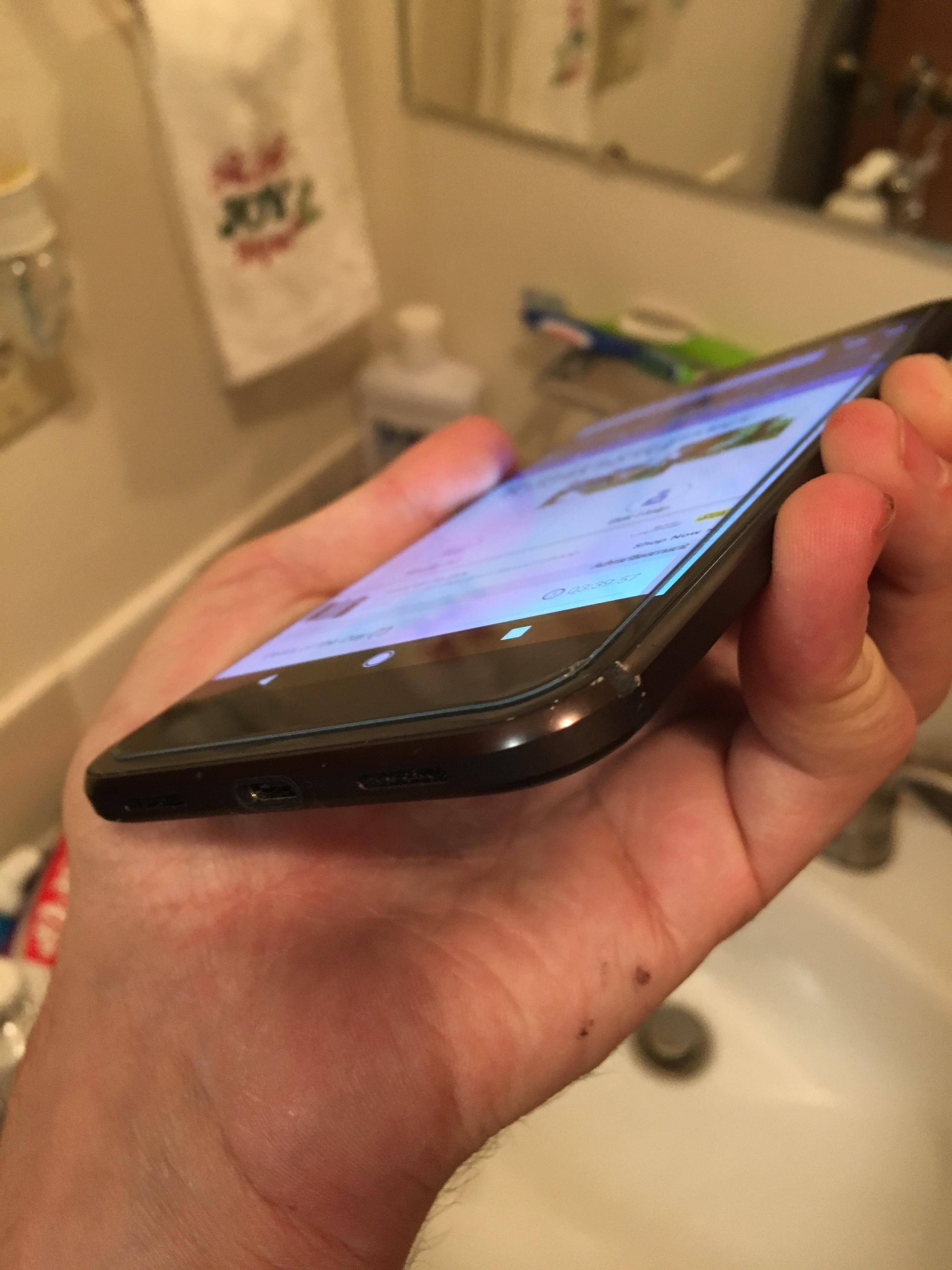 Cosmetic damage I received from the drop on the bottom. Thanks to a delay on driver due to a winter storm I did not have a case on it yet. Thankfully I had the zagg he glass!, click to load a larger version