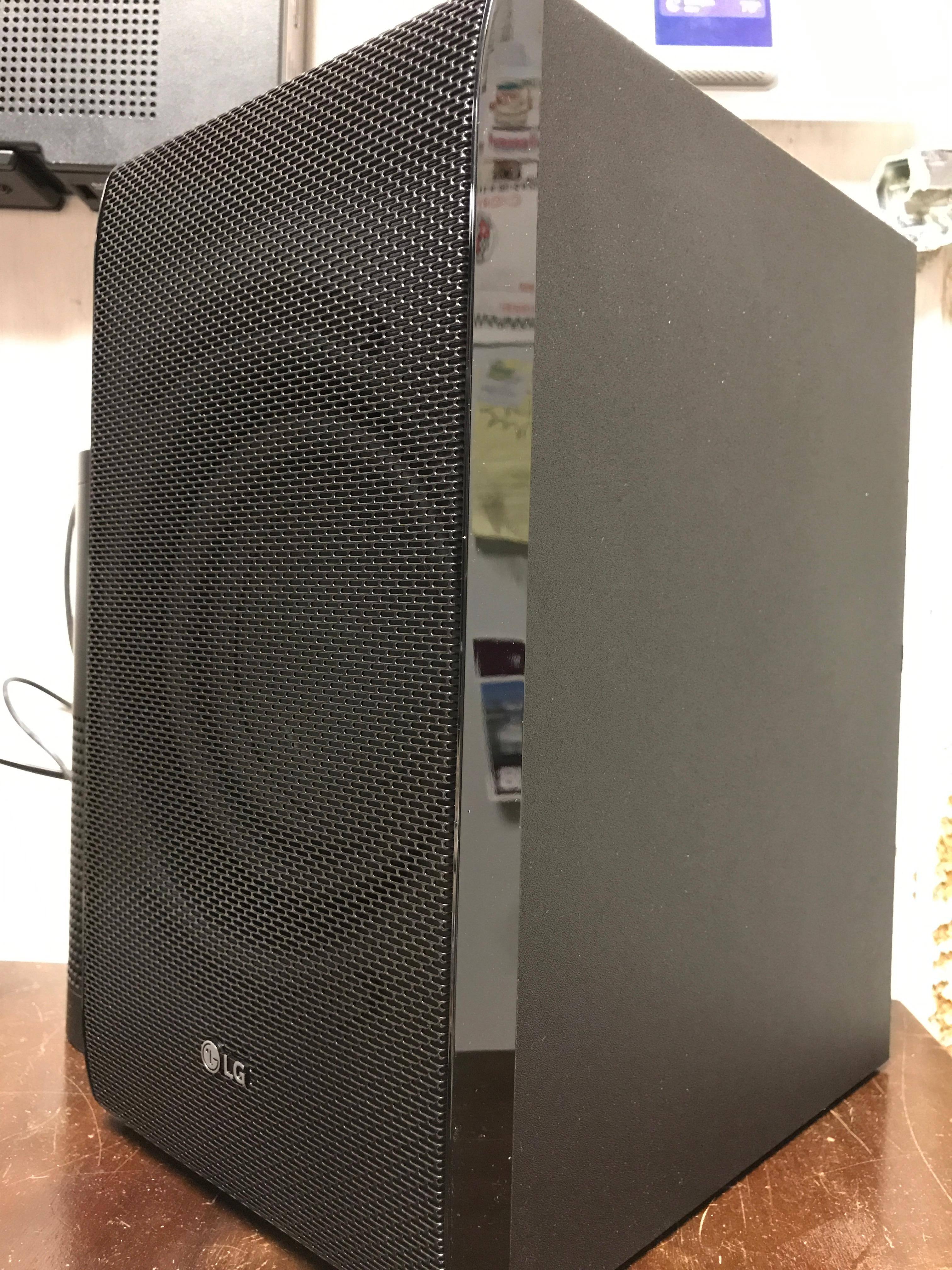 The subwoofer features an attractive grill with curved lines., click to load a larger version