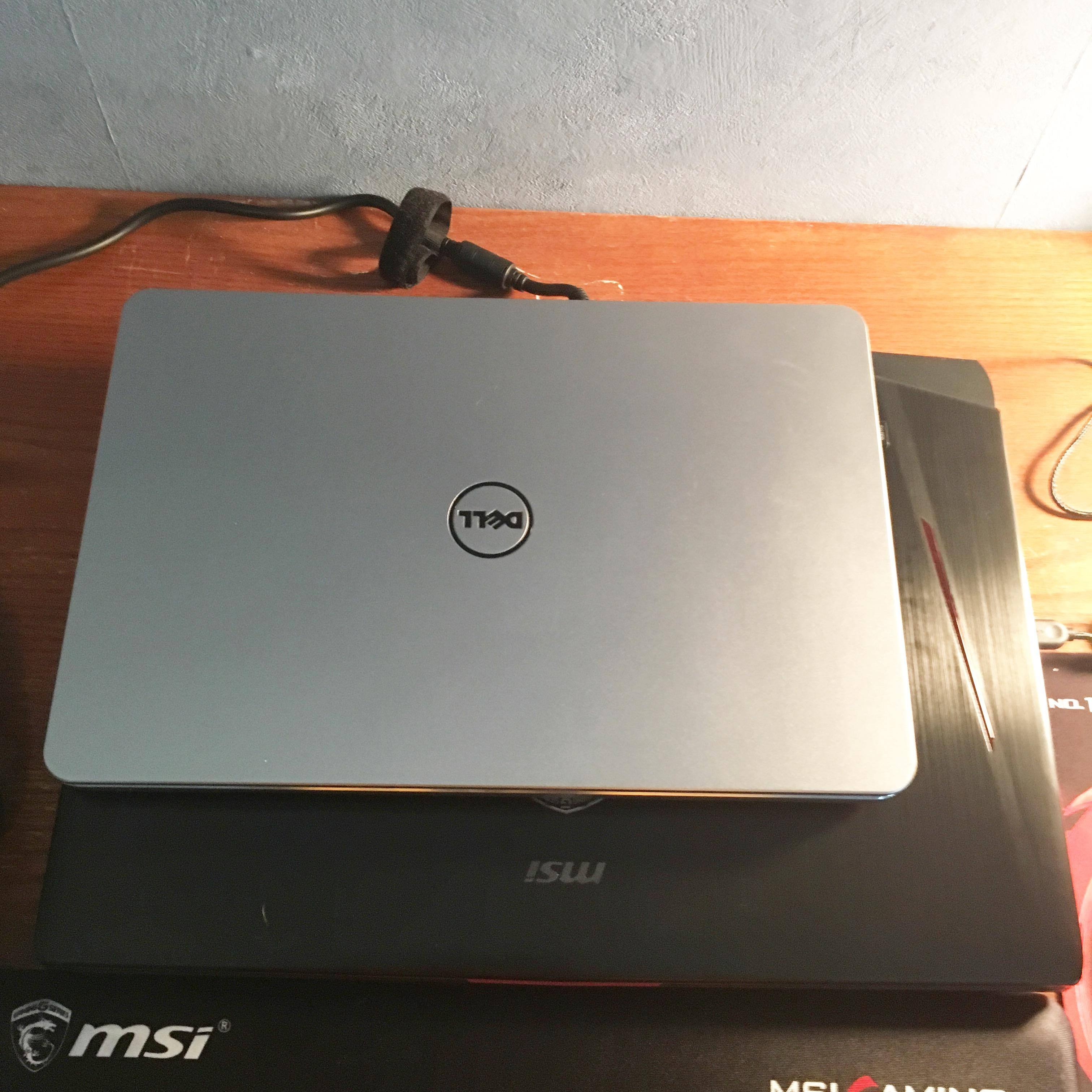 A comparison of the GT80 Titan to a Dell Inspiron 15.6" laptop., click to load a larger version