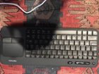 Keyboard with built in trackpad, left and right click buttons, and comes with 2 bluetooth receivers for devices you have that are not bluetooth compatible., click to load a larger version
