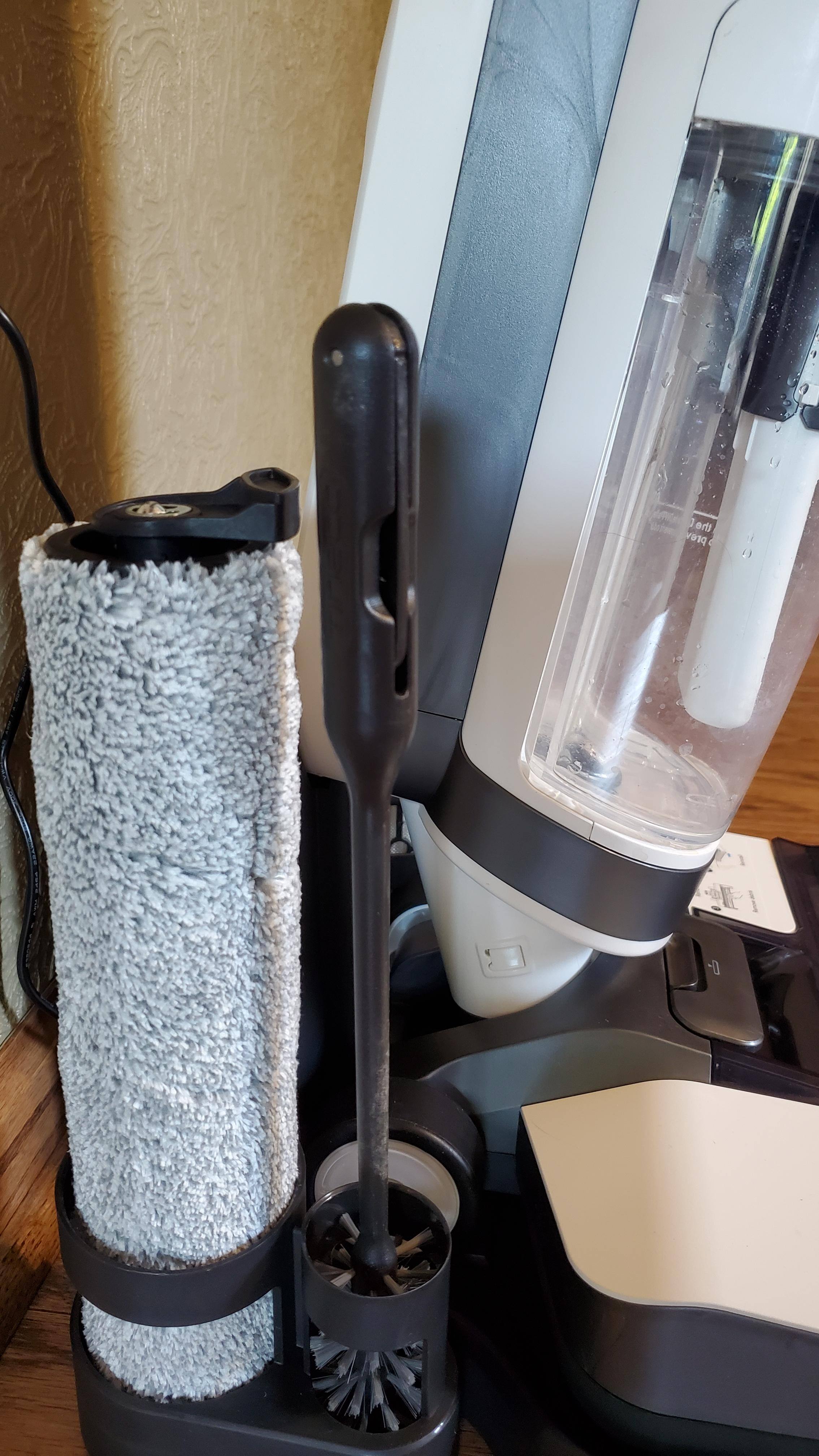 The stand has places to store the brush tool, the extra roller and filter., click to load a larger version