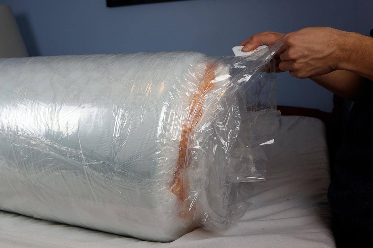 Use cutting tool to remove cling wrap, click to load a larger version