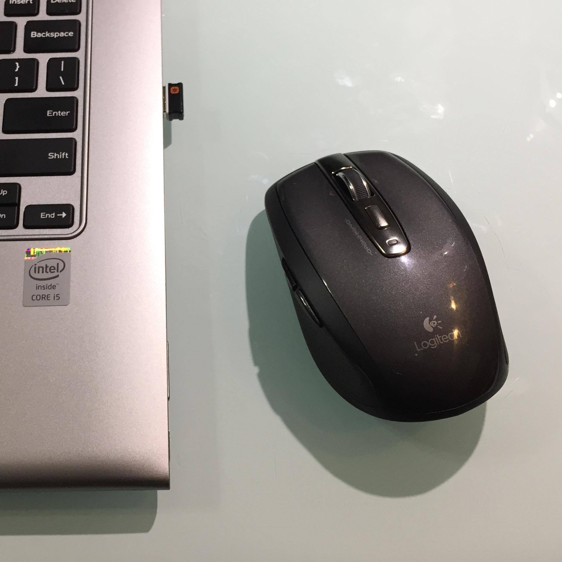 Logitech Anywhere MX on glass table., click to load a larger version