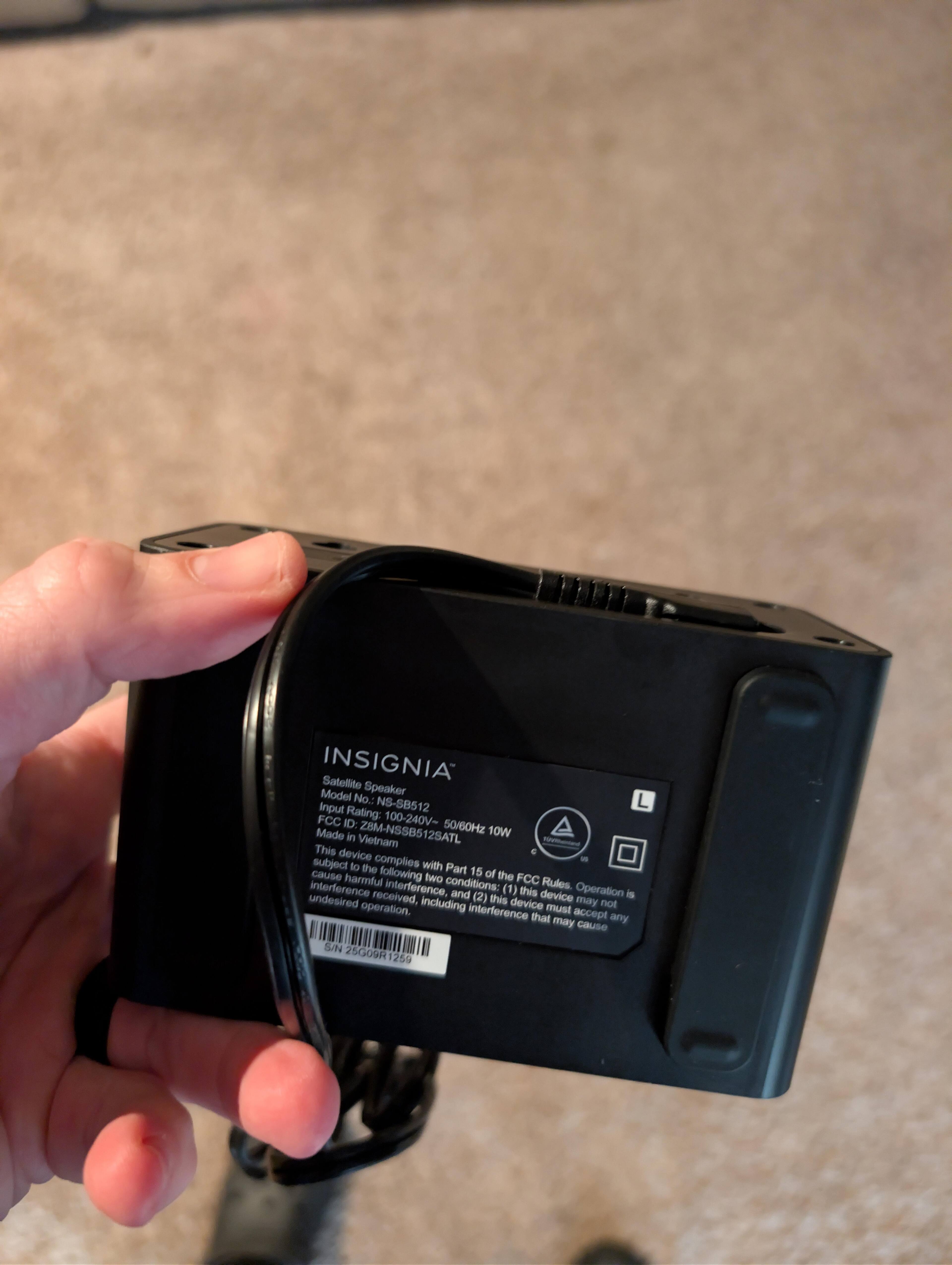 Showing how the power cable comes out of the back of the satelite speaker, click to load a larger version