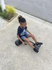 Smiles after we attach his hoverboard. As it was a breeze to control., click to load a larger version