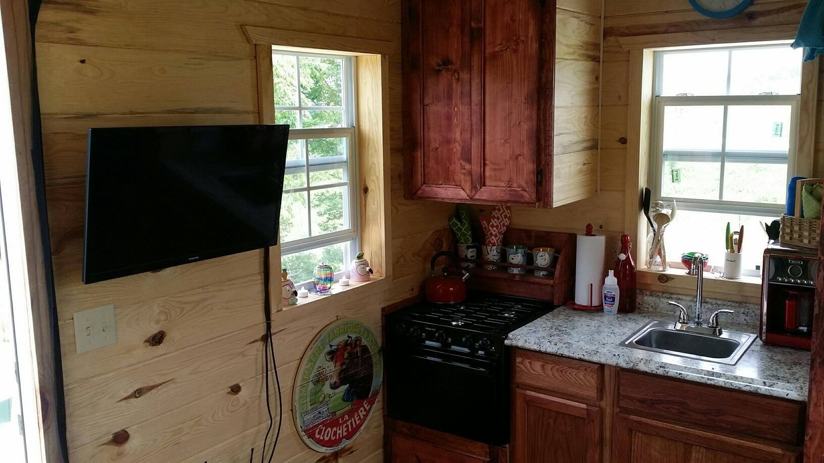 TV on wall at Tiny House, click to load a larger version