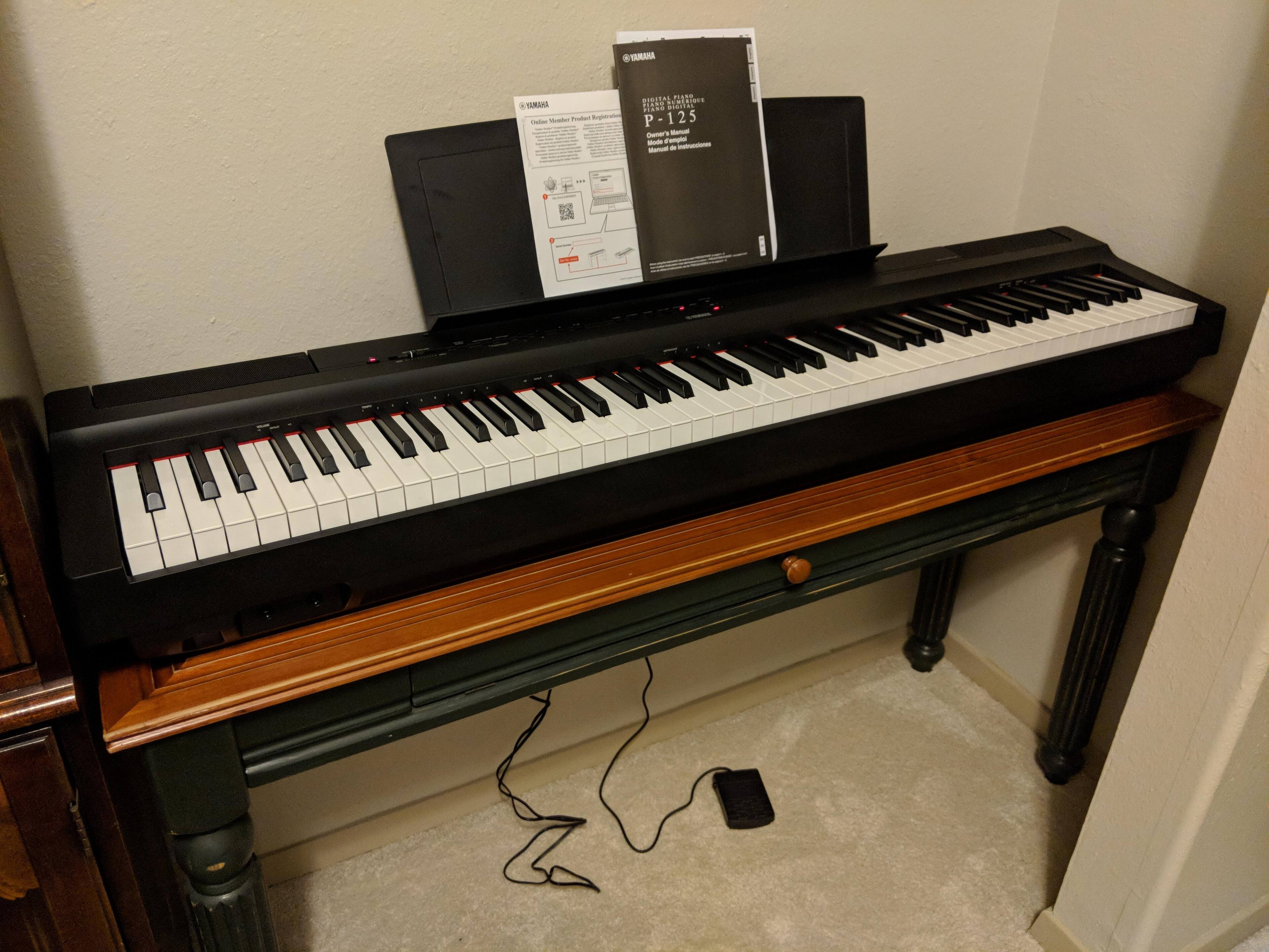 Huge Difference. This is the "Full-size" piano that I received (minus my table). This does not match what Best Buy pictured and represented as a "Full-size" piano., click to load a larger version