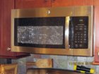 Shattered door on GE microwave oven., click to load a larger version