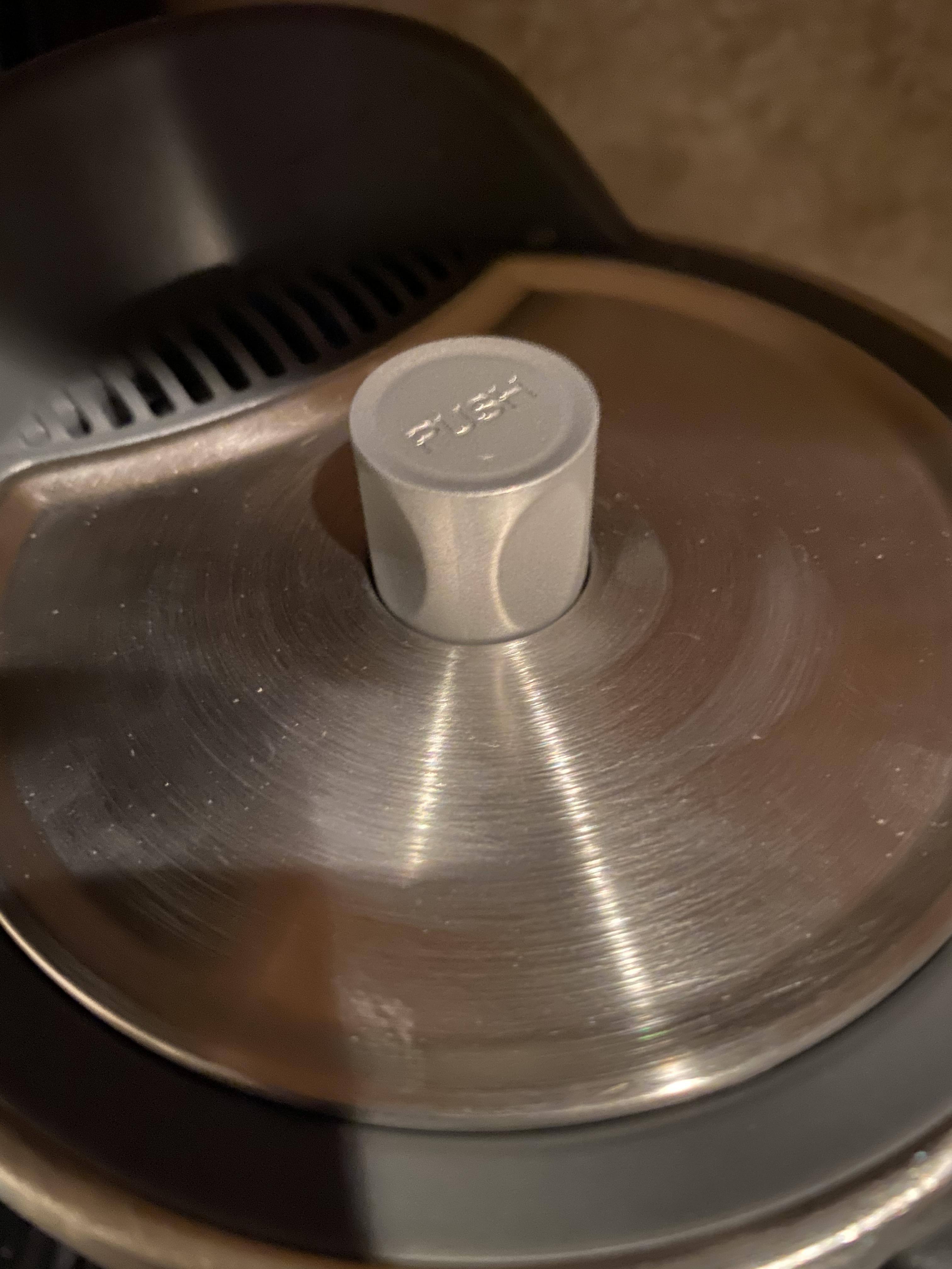 Lid with spring load button, click to load a larger version