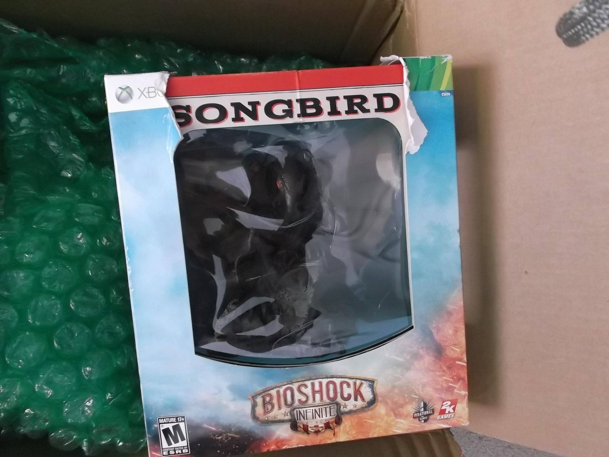 front side and damage to the songbird box, click to load a larger version